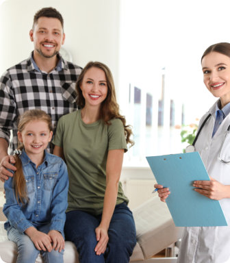 family smiling and nurse