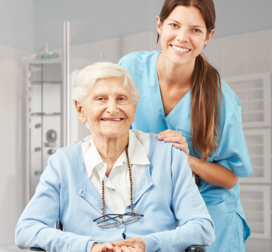 Senior and nurse in the bathroom